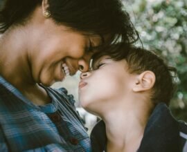 Mother and child touching faces, showing the warmth of gentle parenting