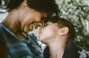 Mother and child touching faces, showing the warmth of gentle parenting
