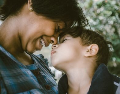 Mother and child touching faces, showing the warmth of gentle parenting